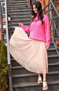 Loose pink sweater with an openwork pattern