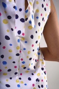 Sleeveless blouse with a V-neck - Colorful spots