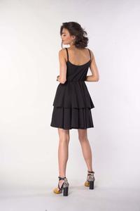 A black dress on straps with an assumed neckline