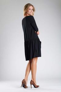 Black Dress with a Loose Fashion. Fastened with buttons